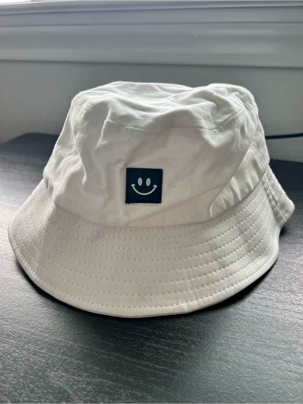 White Bucket Hat with Smiley Patch
